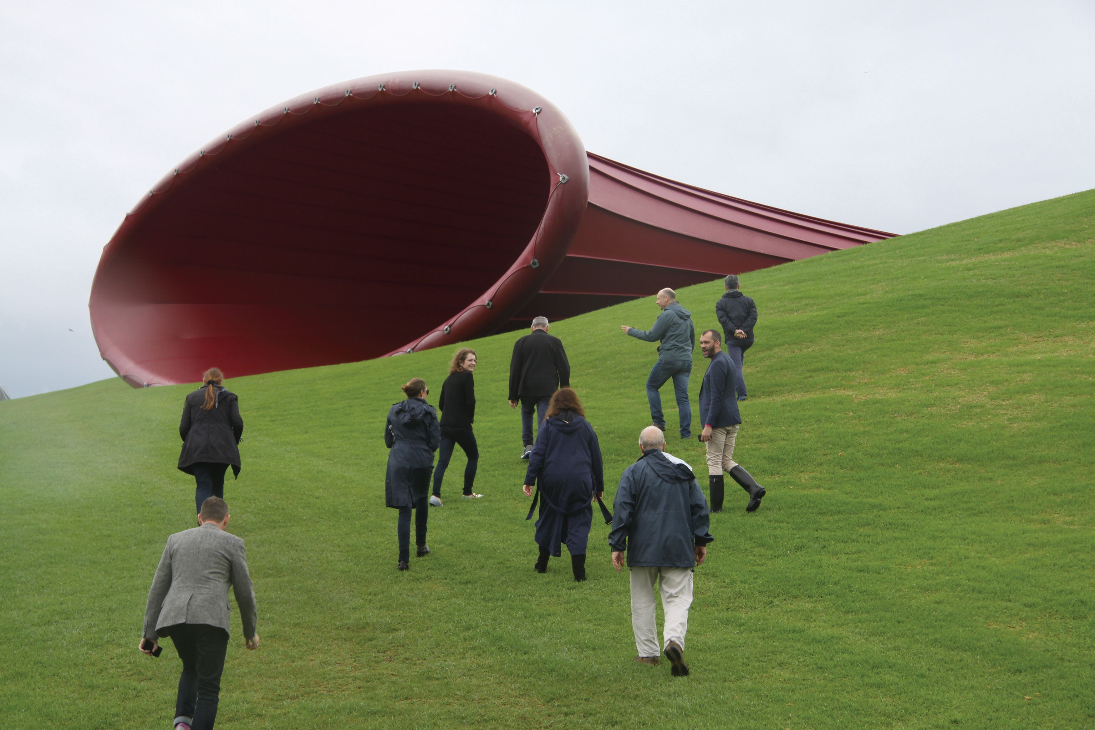 Members of the Contemporary Patrons view Anish Kapoor’s Dismemberment, Site 1 2009 at Gibbs Farm, during a special art tour to Auckland, New Zealand, 2017 / Photograph: D Jones