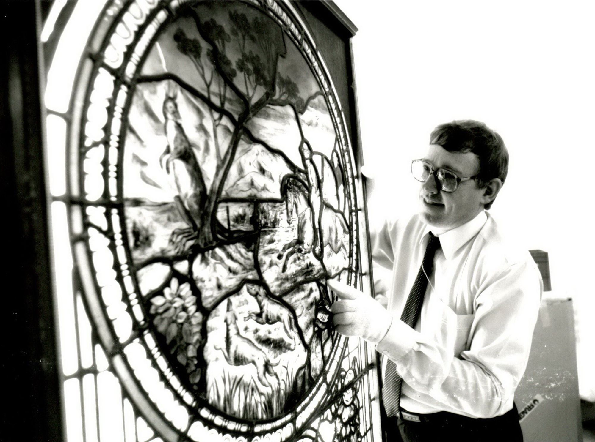 Glenn Cooke with Sidney House stained glass window c.1882 acquired for the QAGOMA Collection in 1988 / Collection: QAGOMA Research Library
