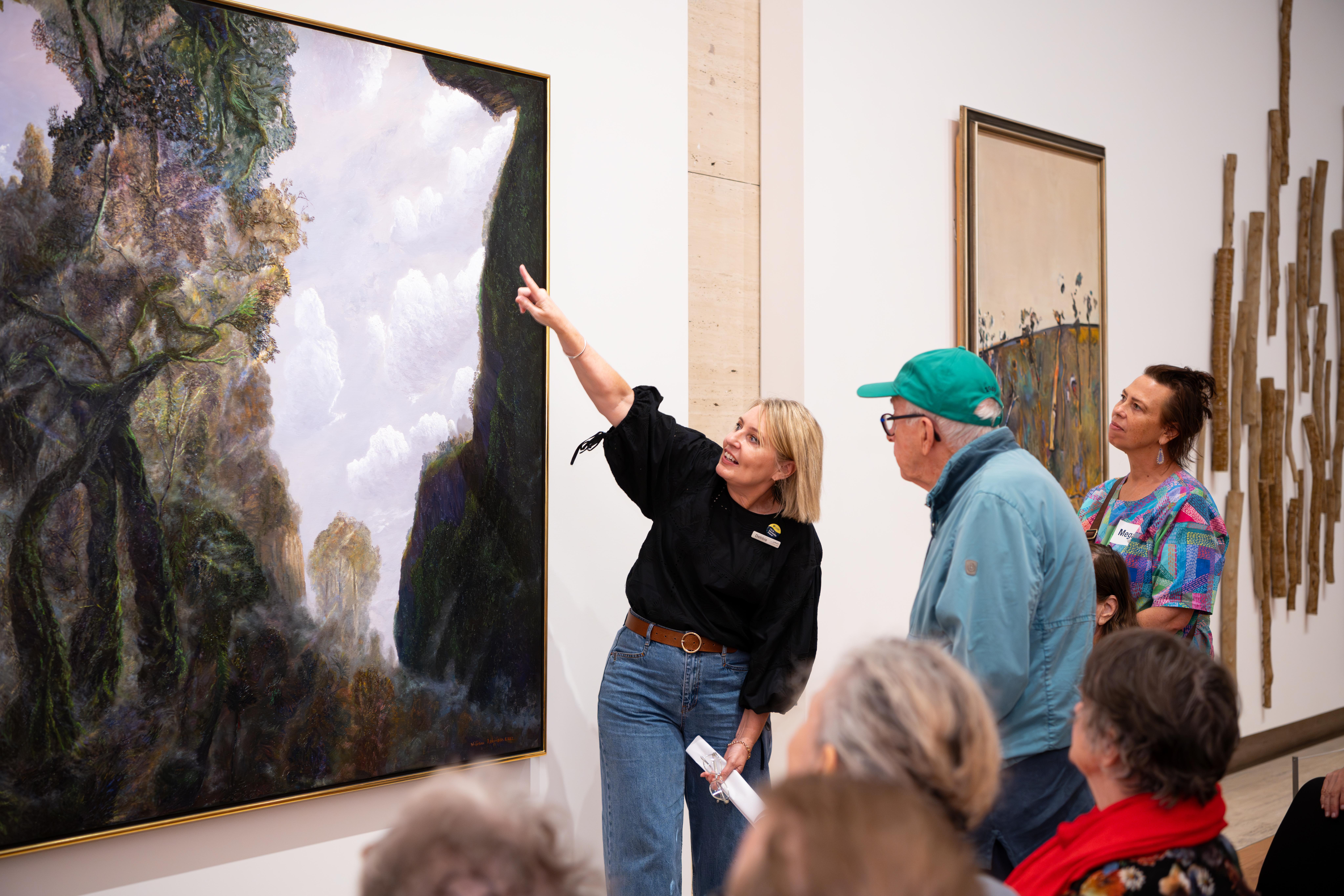 Art and Dementia program participants explore William Robinson’s Rainforest and mist in afternoon light 2002 / Purchased 2017 with funds from the Henry and Amanda Bartlett Trust through the Queensland Art Gallery | Gallery of Modern Art Foundation / Photograph: C Callistemon ©QAGOMA