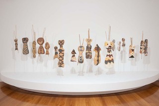 Betty Andy, Yalangi/Waanji people, Australia b.1942 | Daniel Beeron, Girramay people, Australia b. 1972 | Maureen Beeron, Girramay people, Australia b.1957 | Nancy Beeron, Girramay people, Australia b.1949 | Theresa Beeron, Girramay/Jirrbal people, Australia b.1951 | Nancy Cowan, Warrgamay/Warungnu people, Australia b.1952 | Nephi Denham, Girramay people, Australia b.1984 | Allison Murray, Girramay/Jirrbal people, Australia b. 1967 | Doris Kinjun, Gulgnay people, Australia b. 1947 | Emily Murray, Girramay/Jirrbal people, Australia b. 1949 | John Murray, Girramay people, Australia b. 1979 | Sally Murray, Girramay/Jirrbal people, Australia b. 1947 | Ninney Murray, Girramay/jirrbal people, Australia b. 1941 | Bagu (Firestick figure) and Jiman (Firestick) 2009 | Terracotta clay, ochres, string and Native Guava (Eupomatia laurina) | Purchased 2010 with funds from Xstrata Community Partnership Program Queensland through the Queensland Art Gallery Foundation | Collection: Queensland Art Gallery | © The artists