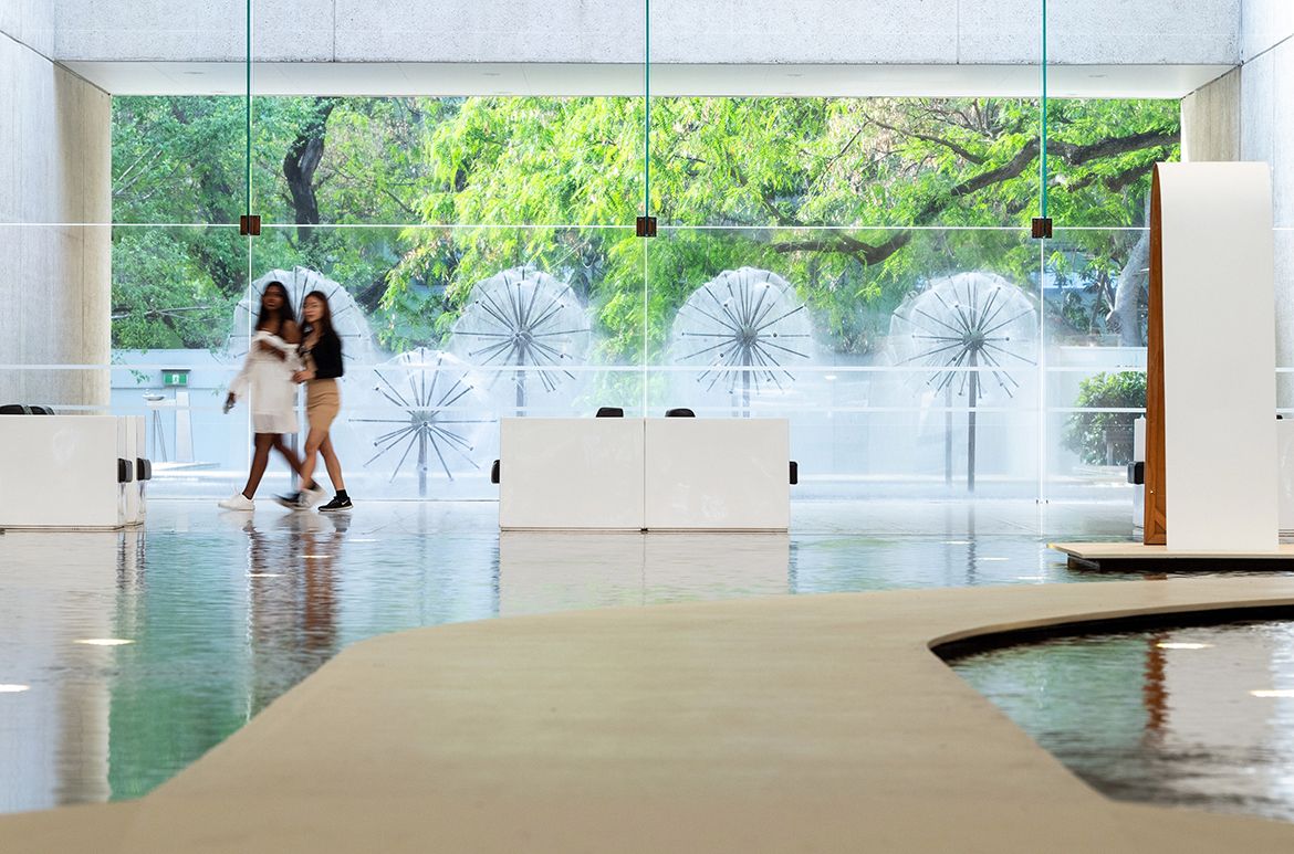 The Queensland Art Gallery's Watermall extends far beyond the Gallery’s interior toward Robert Woodward's ‘Dandelion Fountains’ through to the Gallery’s Sculpture Courtyard reflection pond and waterfall adjoining the QAG Cafe.