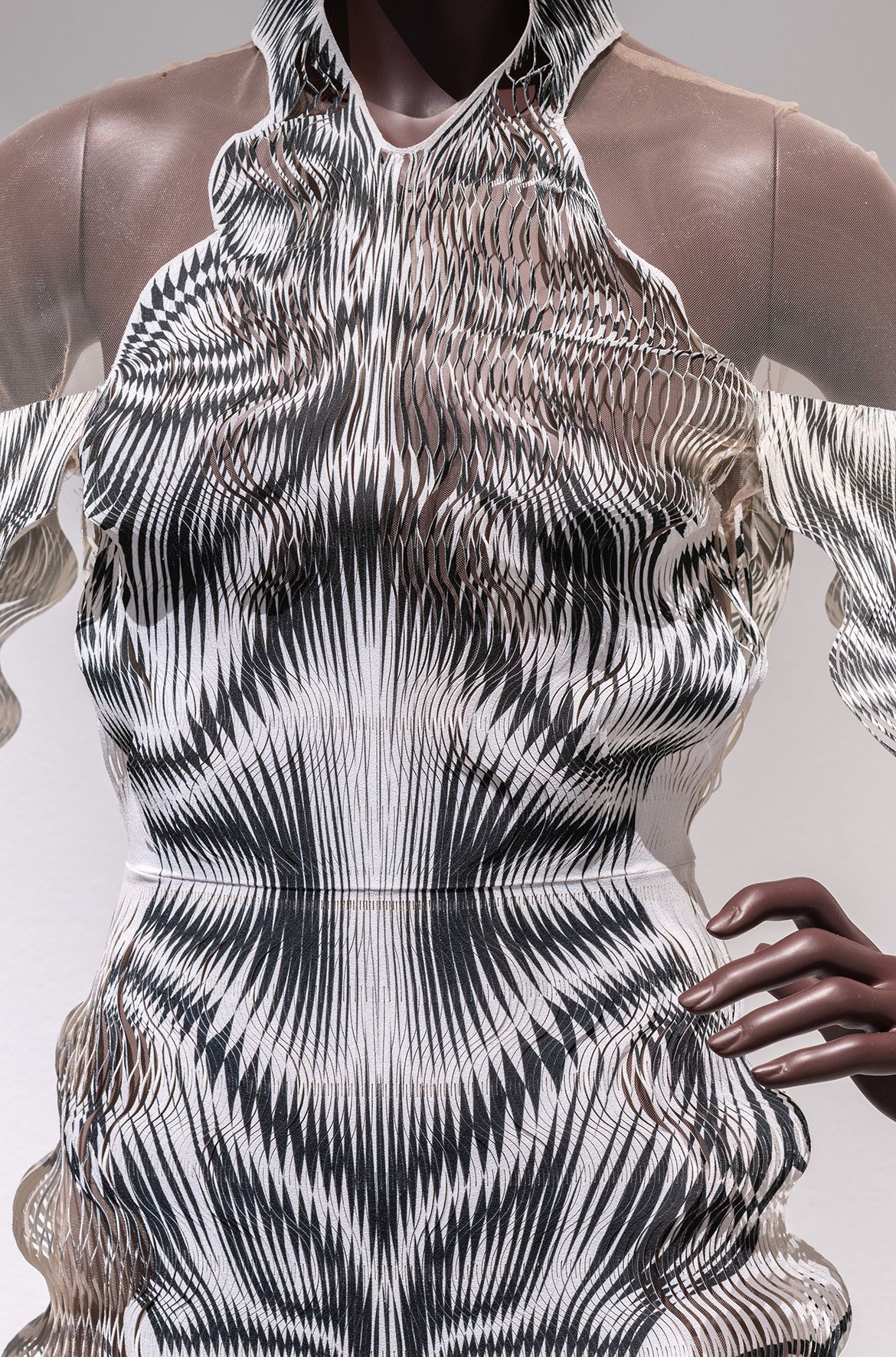 Iris van Herpen, Netherlands b.1984 / Philip Beesley (Collaborator), Canada b.1956 / Hypnosis cape-dress (detail), from the ‘Hypnosis’ collection 2019 / Laser-cut duchesse satin, mylar, tulle / © & courtesy: Iris van Herpen atelier / Photograph: N Umek © QAGOMA