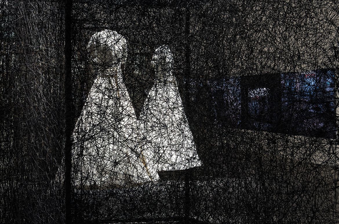 Chiharu Shiota, Japan/Germany b.1972 / Reflections of Space and Time 2018/2022/ Installation view in ‘Chiharu Shiota: The Soul Trembles’, Gallery of Modern Art, Brisbane, 2022 / White dress, mirror, metal frame, Alcantara black thread / 280 x 300 x 400cm / Commissioned by Alcantara S.p.A / © Chiharu Shiota / Photograph: N Harth © QAGOMA
