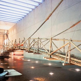 Cai Guo-Qiang, China b.1957 / Bridge Crossing 1999 / Bamboo, rope, rainmaking device, aluminum boat, and laser sensors / Site specific work commissioned 1999 for ‘The Third Asia Pacific Triennial of Contemporary Art’ (APT3) / Courtesy: Cai Guo-Qiang