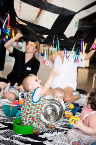 A baby at an Art Starters play session, 2024 / ©QAGOMA / Photo: C Callistemon