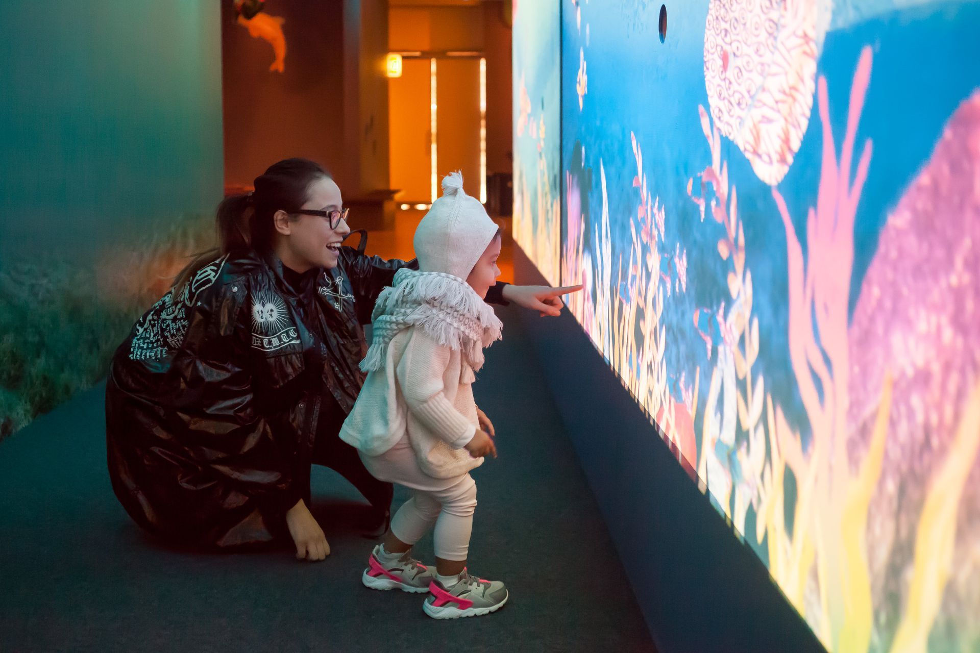 Visitors exploring 'The Gabori Sisters: Gathering by the Sea'