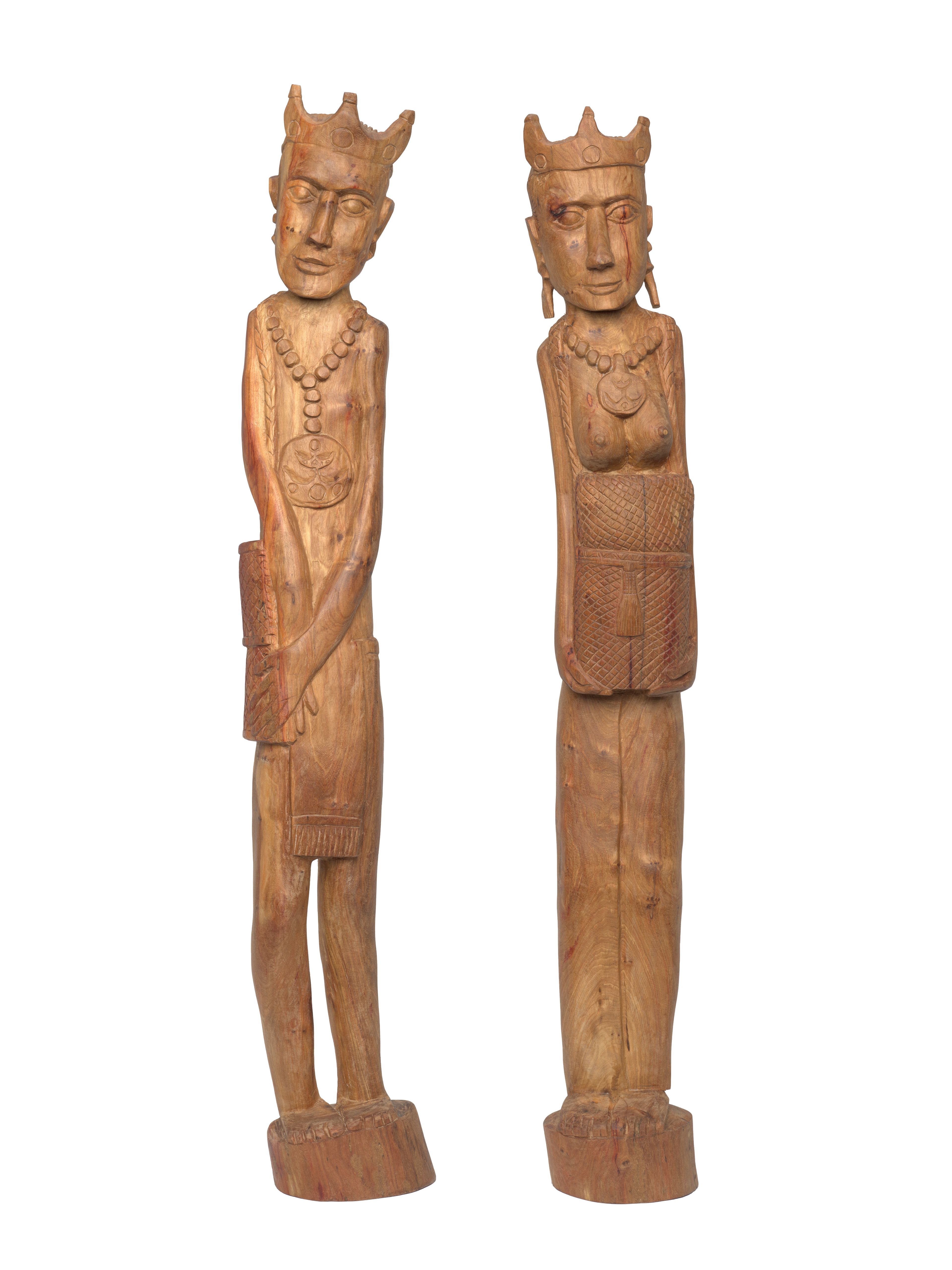 Ataúro sculptors / Ataúro Island, Timor-Leste / Liurai Mane (King) 2024 / Rosewood (Ai na’a) / 120cm (high); Liurai Feto (Queen) 2024 / Rosewood (Ai na’a) / 119cm (high) / Commissioned for APT11 / Purchased 2024 with funds from Ashby Utting through the Queensland Art Gallery | Gallery of Modern Art Foundation / Collection: Queensland Art Gallery | Gallery of Modern Art