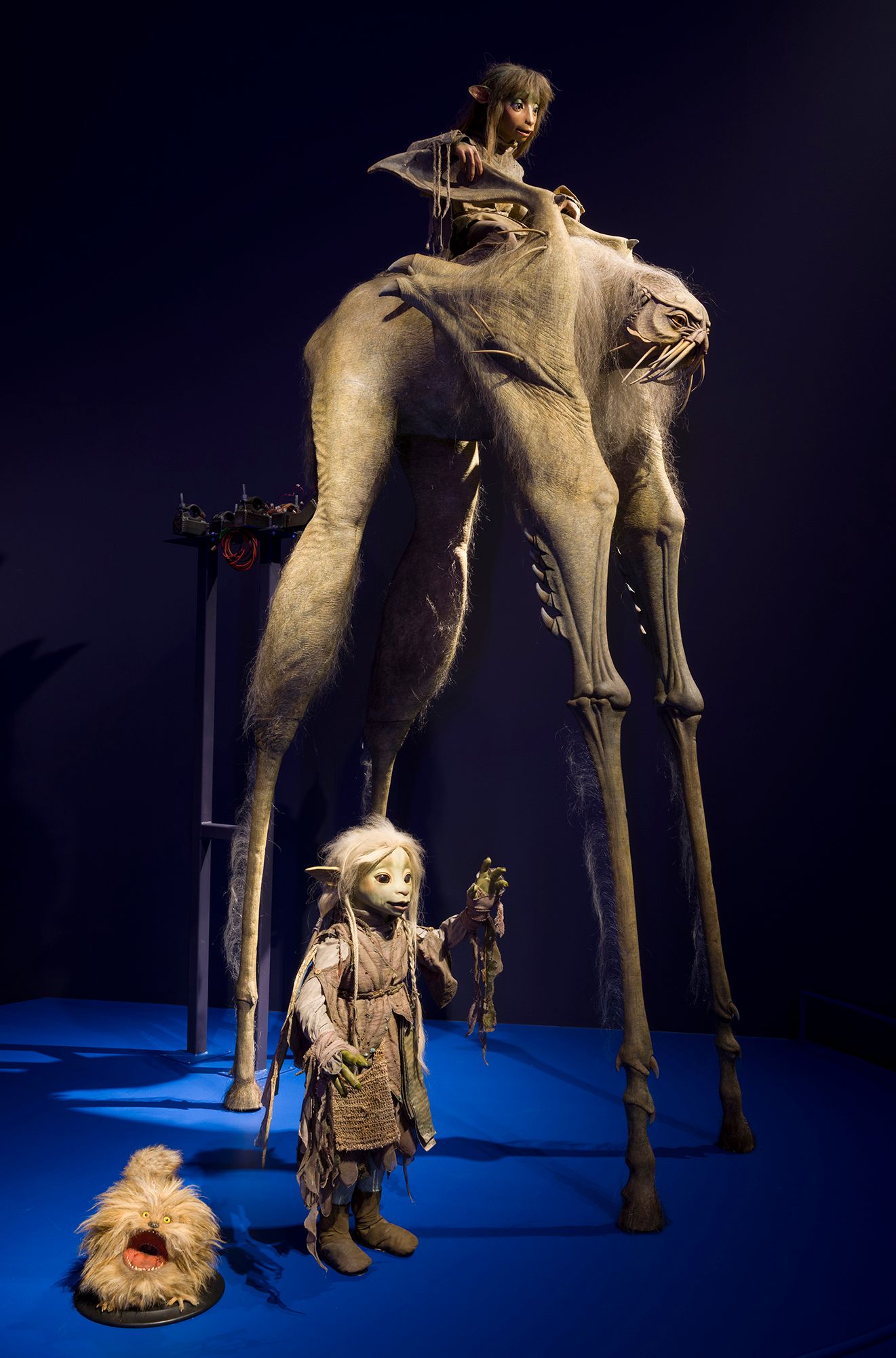Installation view of 'Make, Believe, Magic: The Worlds of The Jim Henson Company', Gallery of Modern Art (GOMA), Brisbane, 2026, featuring 'Fizzgig', ‘Deethra of the Grottan Clan’ Gelfling, ‘Rian of the Stonewood Clan’ Gelfling and ‘Landstrider’ puppets from The Dark Crystal: Age of Resistance 2019 / Collections: The Jim Henson Company, Netflix Archive, Los Angeles and Museum of the Moving Image, New York / © The Jim Henson Company. All Rights Reserved / Photograph: C Callistemon © QAGOMA