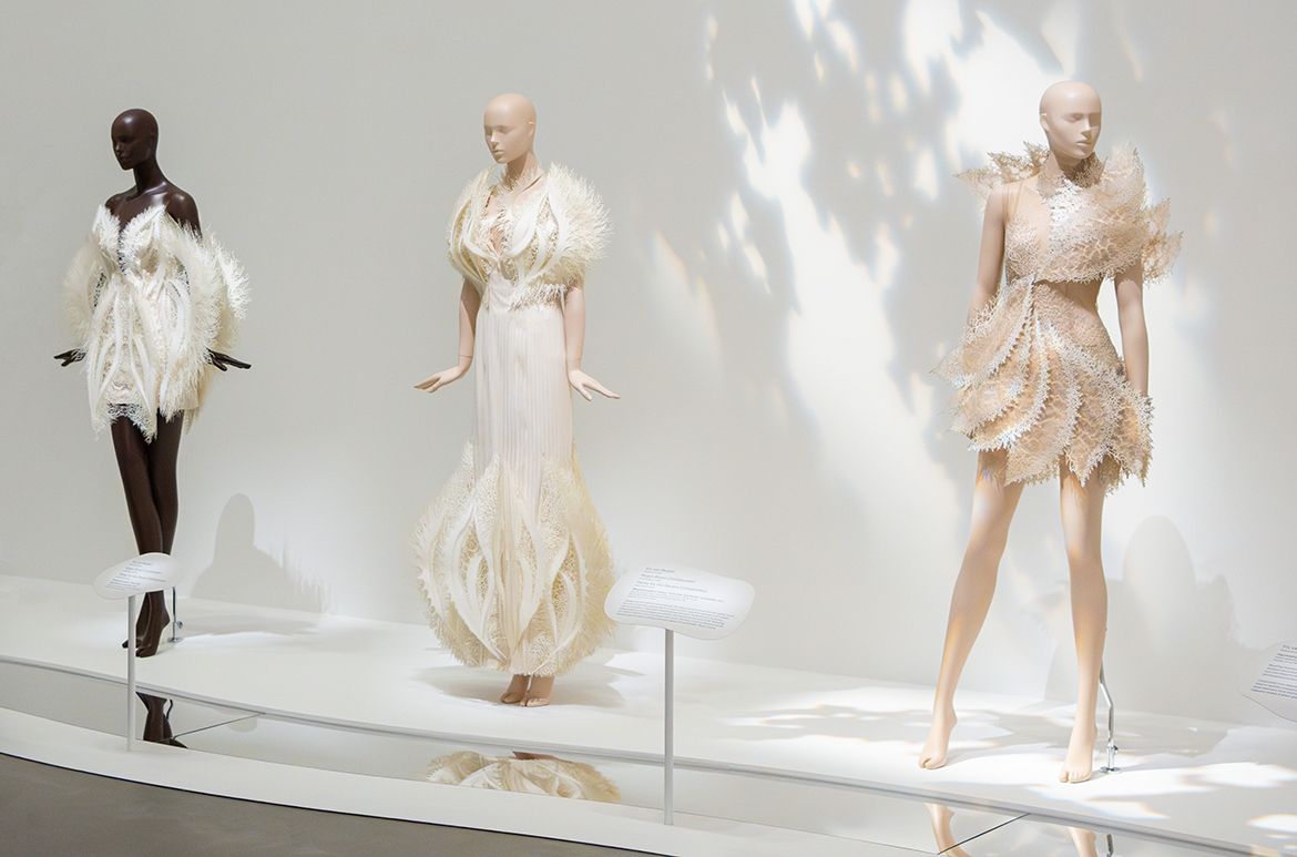 (L to R) Iris van Herpen, Netherlands b.1984 / Rogan Brown (Collaborator) United Kingdom b.1966 / Parley for the Oceans (Collaborator) United States est.2012 / Empyrean dress, from the ‘Earthrise’ collection 2021; Laser-cut upcycled Parley Ocean Plastic, cotton, mylar / Empyrean gown, from the ‘Earthrise’ collection 2021; Laser-cut upcycled Parley Ocean Plastic, cotton, mylar / Magnetosphere dress, from the ‘Earthrise’ collection 2021; Laser-cut upcycled Parley Ocean Plastic, cotton, mylar, tulle, silk and lace; Worn by actor Hailee Steinfeld at the Met Gala, New York, 2021 / © & courtesy: Iris van Herpen atelier / Photograph: C Callistemon © QAGOMA