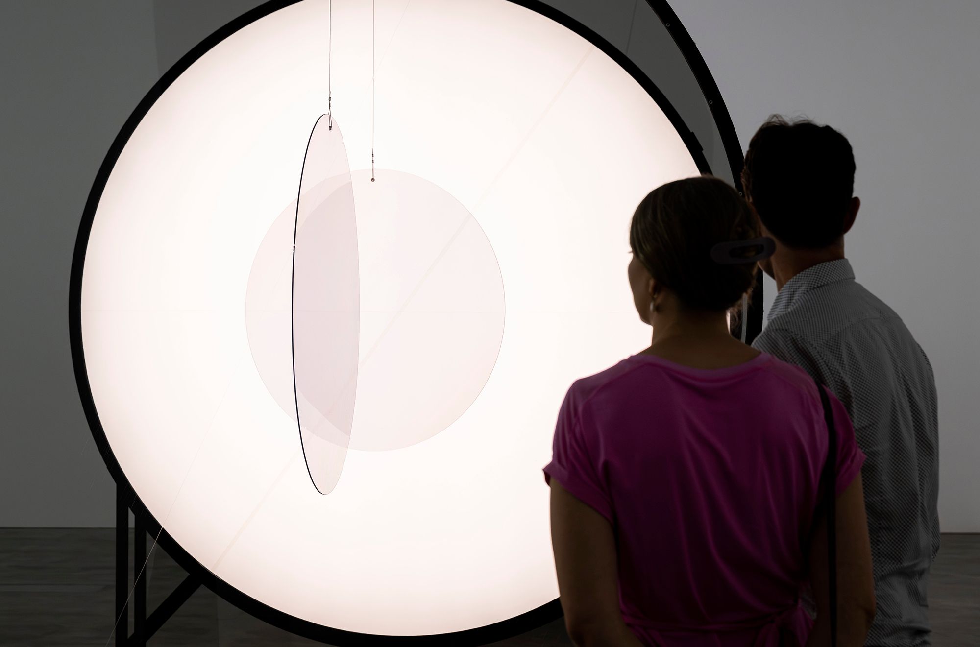 Olafur Eliasson, Denmark b.1967 / Your negotiable vulnerability seen from two perspectives 2025 / Polarisation filters, steel, wood, LEDs, motors, electrical ballast, polyhedron (PVC, resin, motor, control unit) / © 2025 Olafur Eliasson / Courtesy: The artist; neugerriemschneider, Berlin; and Tanya Bonakdar Gallery, New York / Photograph: C Callistemon © QAGOMA