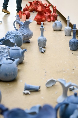 Ben Quilty creates a series of site-specific, hand-drawn portraits of Olley. These large-scale chalk drawings are based on preparatory sketches he made for the Archibald portrait. Quilty has cast in chalk some of the objects Olley gave him over the years; teapots, jugs, and vases, and used these to produce the wall drawings.