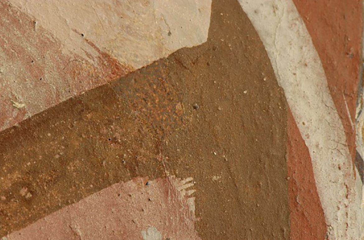 During the overpaint removal, the first image in this series shows the dark brown overpaint, the second the overpaint removed and the third the paper pulp fill and the beginning of inpainting using watercolour. The last image shows the loss after treatment.