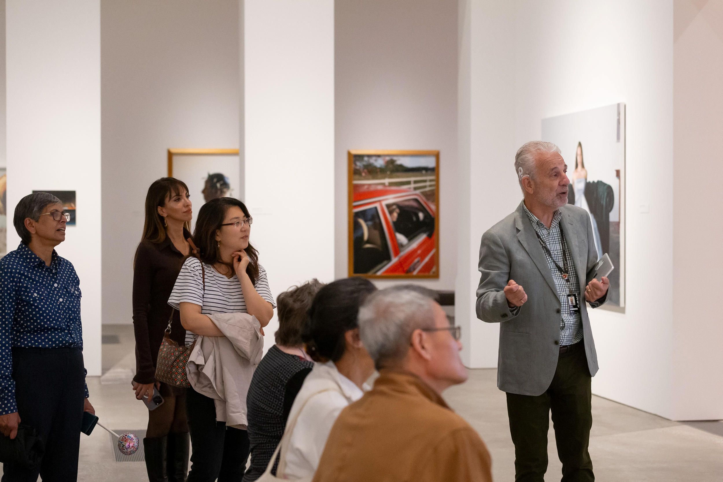 A Volunteer Guide leads visitors on a tour at the Queensland Art Gallery. Photography: Claudia Baxter | QAGOMA
