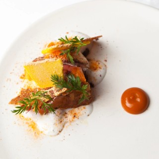Molasses cake, juicing carrots, ricotta, grape / Photograph: Judit Losh, for Delicious Magazine