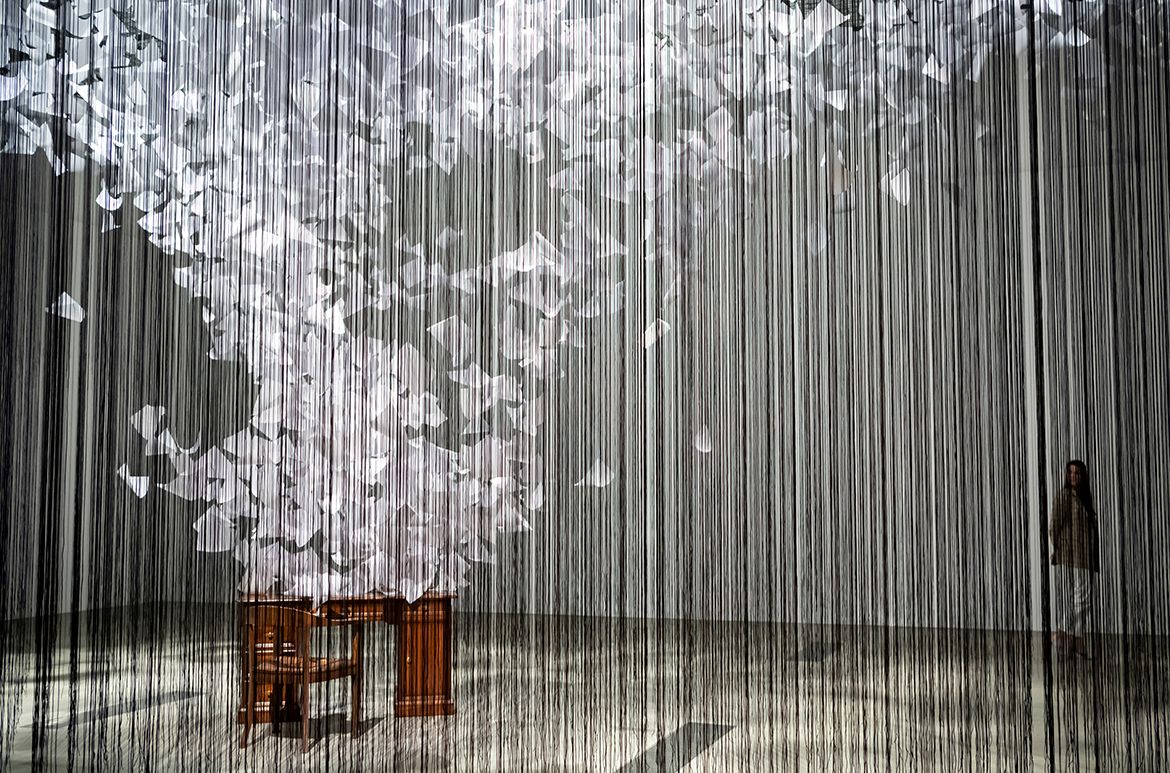 Chiharu Shiota, Japan/Germany b.1972 / Installation view of A question of perspective 2022 in ‘The Soul Trembles’, Gallery of Modern Art, Brisbane / Polypropylene ropes, 80mg paper, found furniture, cable ties, staples / 500 x 810 x 1215cm / Commissioned 2022 with funds from Tim Fairfax AC through the QAGOMA Foundation / Collection: Queensland Art Gallery | Gallery of Modern Art / © Chiharu Shiota / Photograph: C Callistemon © QAGOMA