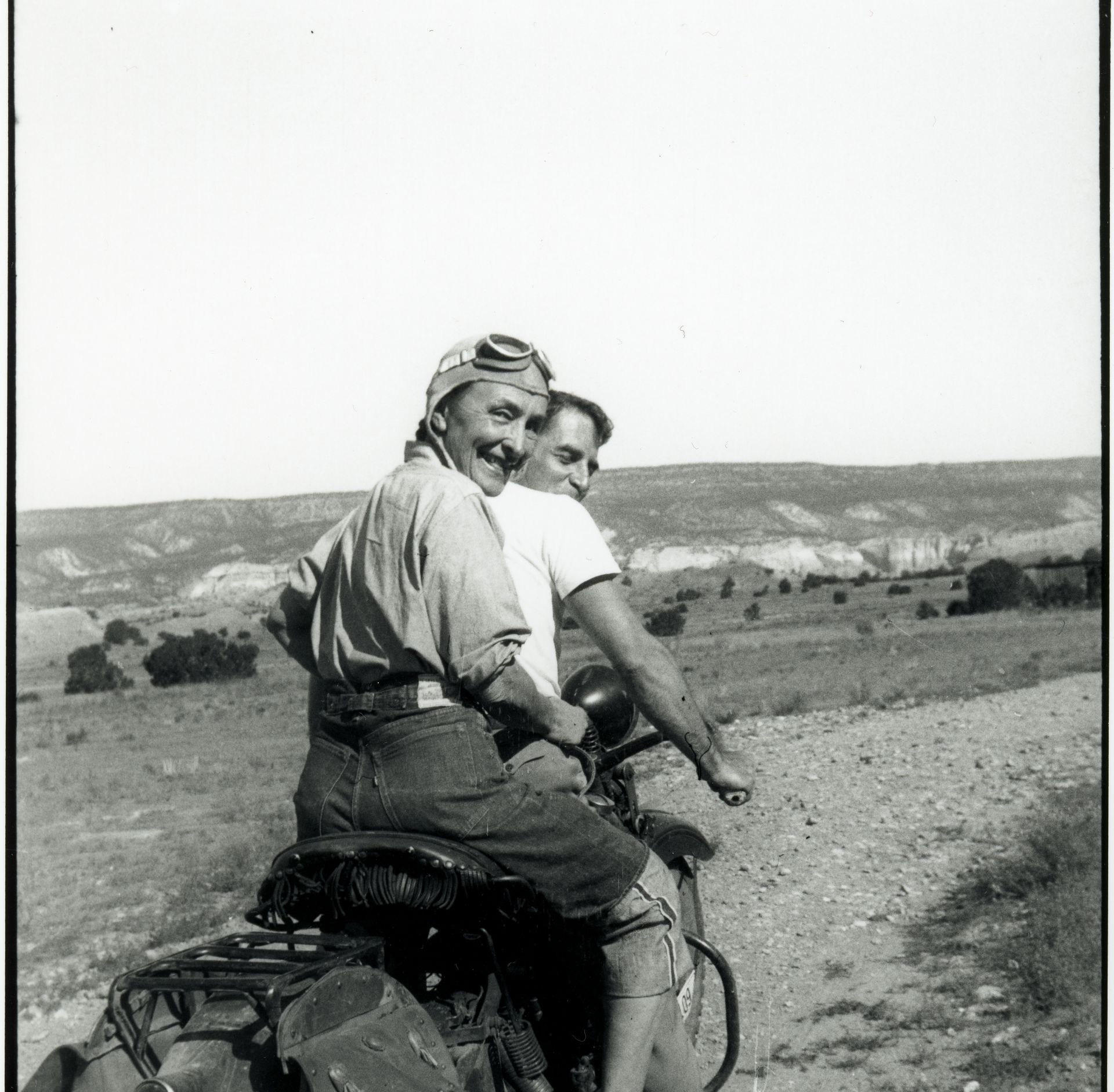 Photograph: Maria Chabot, Georgia O'Keeffe Hitching a Ride to Abiquiu with Maurice Grosser, 1944. Contemporary Photographic Print, 8 x 10 in. Georgia O'Keeffe Museum. Gift of The Georgia O'Keeffe Foundation (RC.2001.002.140e). © Georgia O'Keeffe Museum