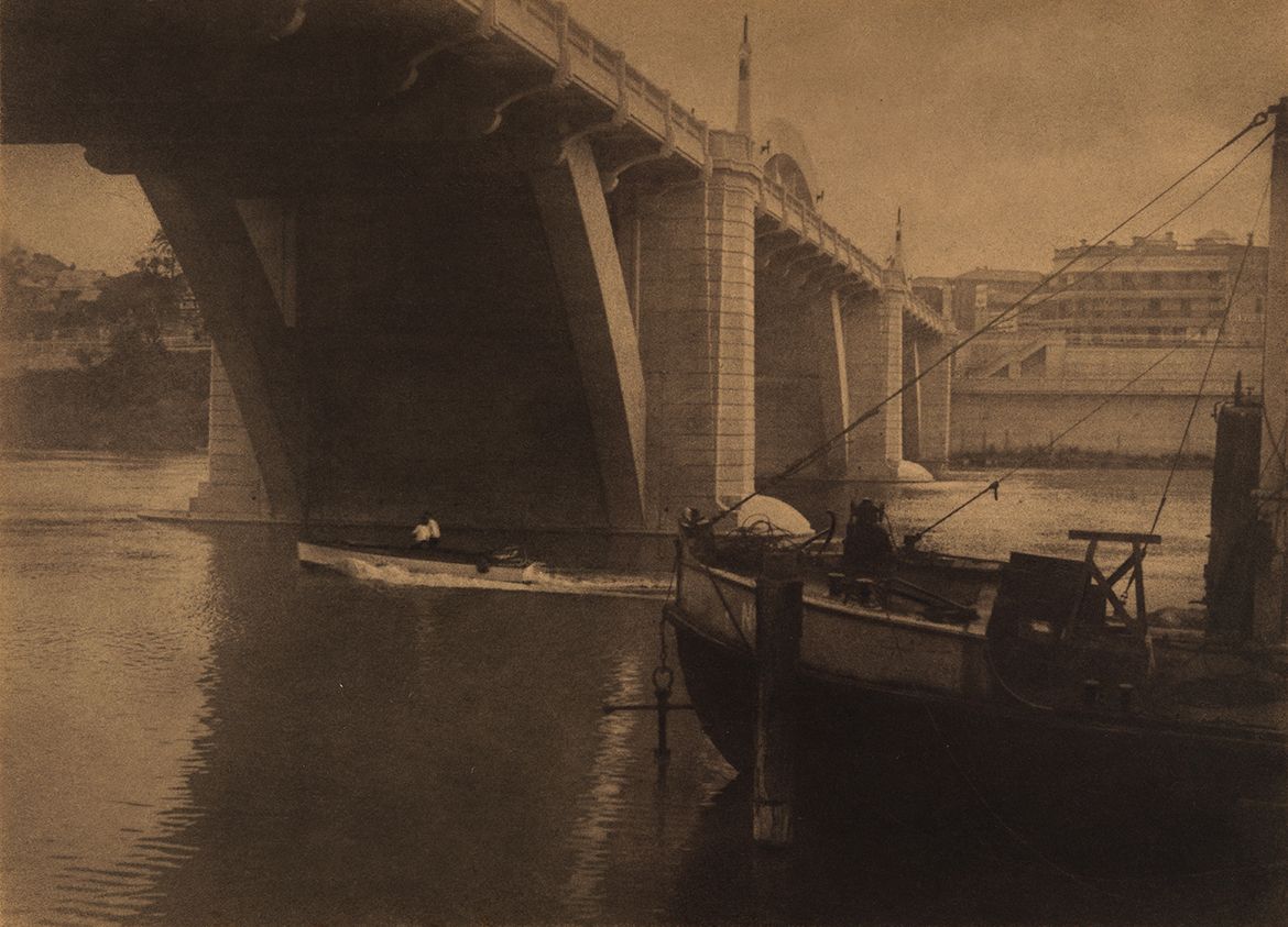 Stanley W Eutrope, Australia 1891–1983 / Under the bridge (Grey Street Bridge, Brisbane) c.1933 / Bromoil photograph on paper / 21.5 x 29.7cm (comp) / Acc. 1984.054 / Gift of Mrs J. Searston in memory of her mother, Mrs Florence Radford, through Miss Shirley Eutrope 1984 / Collection: Queensland Art Gallery | Gallery of Modern Art