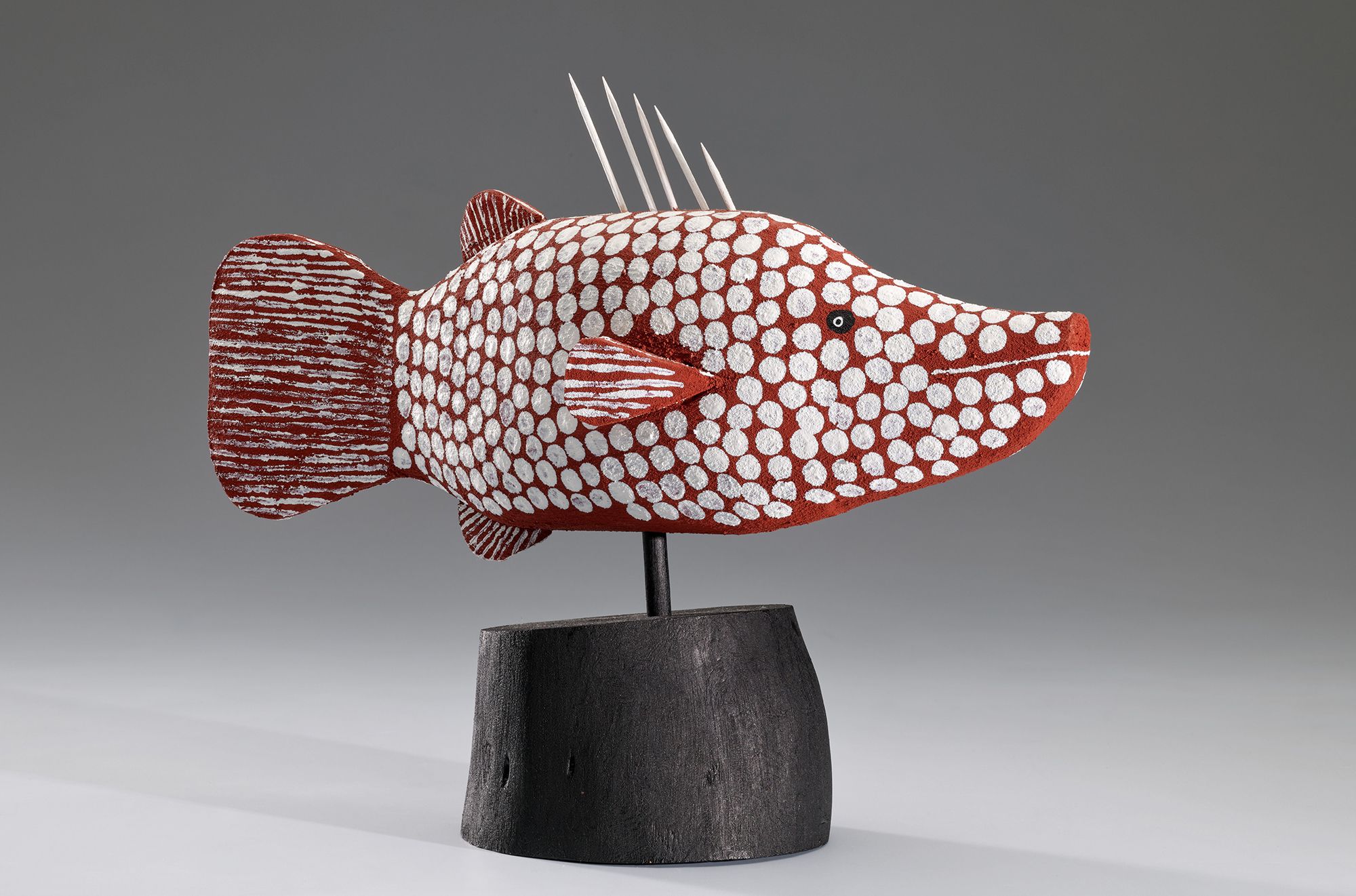Craig Koomeeta, Wik-Alkan people, Australia b.1977 / Wuungkun (Barramundi in Apelech design) 2004 / Carved milkwood with synthetic polymer paint and natural pigments / 24.5 x 38 x 10cm (including stand) / Purchased 2004 / Collection: Queensland Art Gallery | Gallery of Modern Art / © Craig Koomeeta