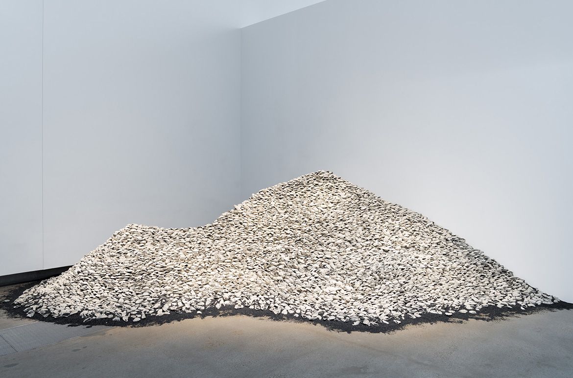 Megan Cope, Quandamooka people, Australia b.1982 / RE FORMATION 2019 / 12 000 pieces of cast-concrete, ilmenite / Purchased 2019 with funds from the Contemporary Patrons through the Queensland Art Gallery | Gallery of Modern Art Foundation / Collection: Queensland Art Gallery | Gallery of Modern Art / © Megan Cope