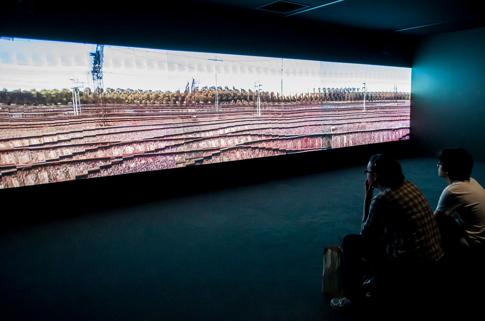 Daniel Crooks, New Zealand/Australia b.1973 / Train No.1 2005 / Three-channel digital video: 4:10 minutes, colour, 16:9 (each channel) / Purchased 2016. Queensland Art Gallery | Gallery of Modern Art Foundation / Collection: Queensland Art Gallery | Gallery of Modern Art / © Daniel Crooks