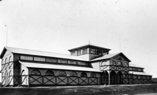 Original Exhibition Building, Bowen Hills, c. 1877. Brisbane’s first exhibition building for the Queensland National Agricultural and Industrial Association occupied the land before the current Exhibition Building and Concert Hall (Old Museum Building) and was destroyed by fire in 1888. The current exhibition building was built in 1891, however the Queensland Government took over control of the building and grounds when the National Association was forced into liquidation by the economic depression in 1897 / 61133 / Courtesy: John Oxley Library, State Library of Queensland, Brisbane