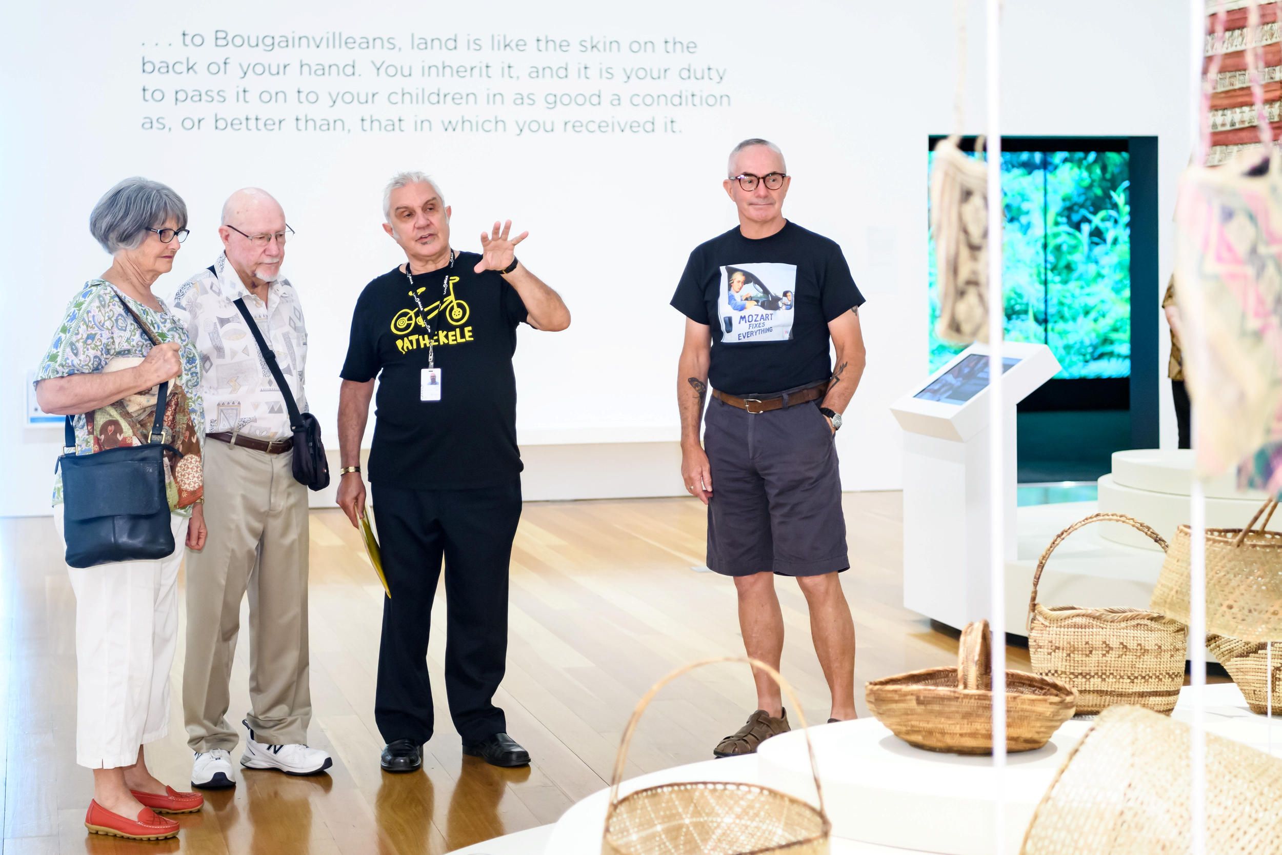 A Volunteer Guide engages visitors on a tour at the QAGOMA.

Photography by Chloe Callistemon | QAGOMA