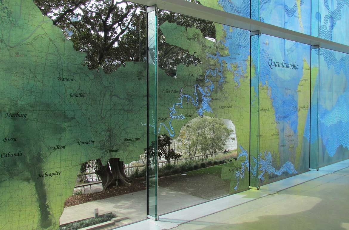 Megan Cope, Qld b.1982 / Fluid Terrain 2012 / Vinyl on glass (art work produced from watercolour and synthetic polymer paint on military maps with digital text) / Site-specific commission for ‘My Country, I Still Call Australia Home: Contemporary Art from Black Australia’ / Courtesy and ©: The artist