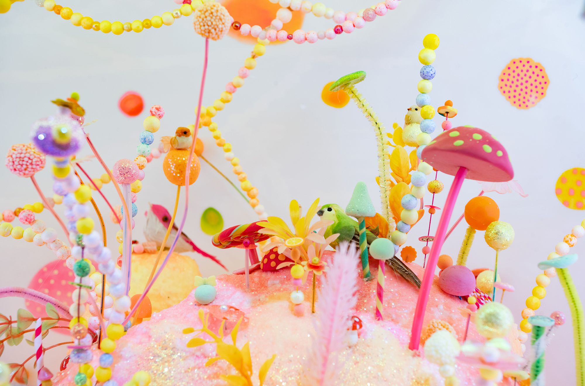 Pip & Pop, Australia 2007–2011 / Tanya Schultz, Australia b.1972 / Nicole Andrijevic, Australia b.1981 / 'Rainbow bridge' from 'we miss you magic land!' 2011 / Dioramas: Polystyrene, wax, fluorescent pigments, sugar, glue, glitter, synthetic polymer paint, plastic plants, plastic flowers, pipe-cleaners, modelling clay, paper, adhesive vinyl, pigment ink, beads in vitrine with internal electric lighting with perspex inserts; installed with wallpaper: digital adhesive on paper (produced from digital file) / Commissioned for ‘Pip & Pop: we miss you magic land’ 2011, a collaboration with QAGOMA’s Children’s Art Centre / Gift of the artists through the QAG Foundation 2013 / Collection: Queensland Art Gallery | Gallery of Modern Art / © Pip & Pop