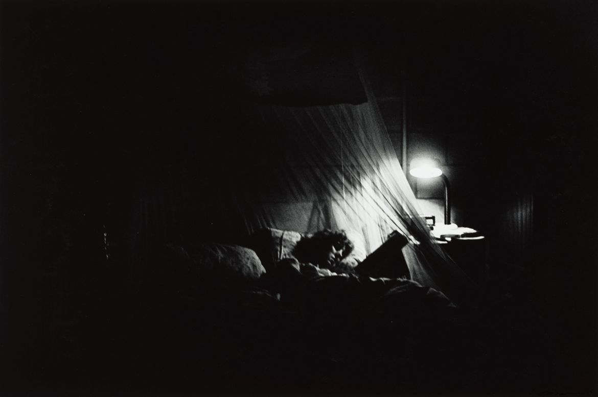 Glen O’Malley, Australia b.1948 / 30 December 1986, Murray Upper – Sue was reading in bed (from ‘Journeys north’ portfolio) 1986 / Gelatin silver photograph on paper / 50.5 x 60.5cm / Purchased 1987 with the financial assistance of the Australian Bicentennial Authority to commemorate Australia’s Bicentenary in 1988 / Collection: Queensland Art Gallery | Gallery of Modern Art / © Glen O’Malley