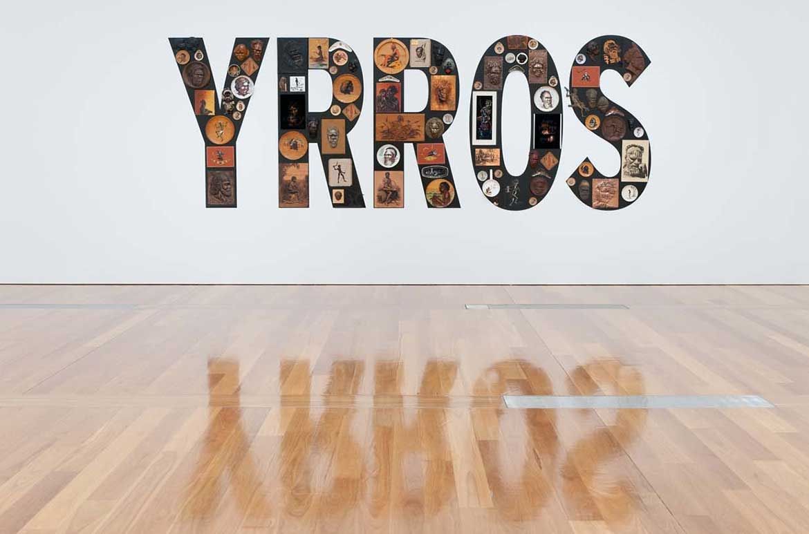 Tony Albert, Girramay people, Australia b.1981 / Sorry 2008 / Found kitsch objects applied to vinyl letters / 99 objects: 200 x 510 x 10cm (installed) / The James C Sourris, AM, Collection. Purchased 2008 with funds from James C Sourris through the Queensland Art Gallery Foundation / Collection: Queensland Art Gallery | Gallery of Modern Art / © Tony Albert