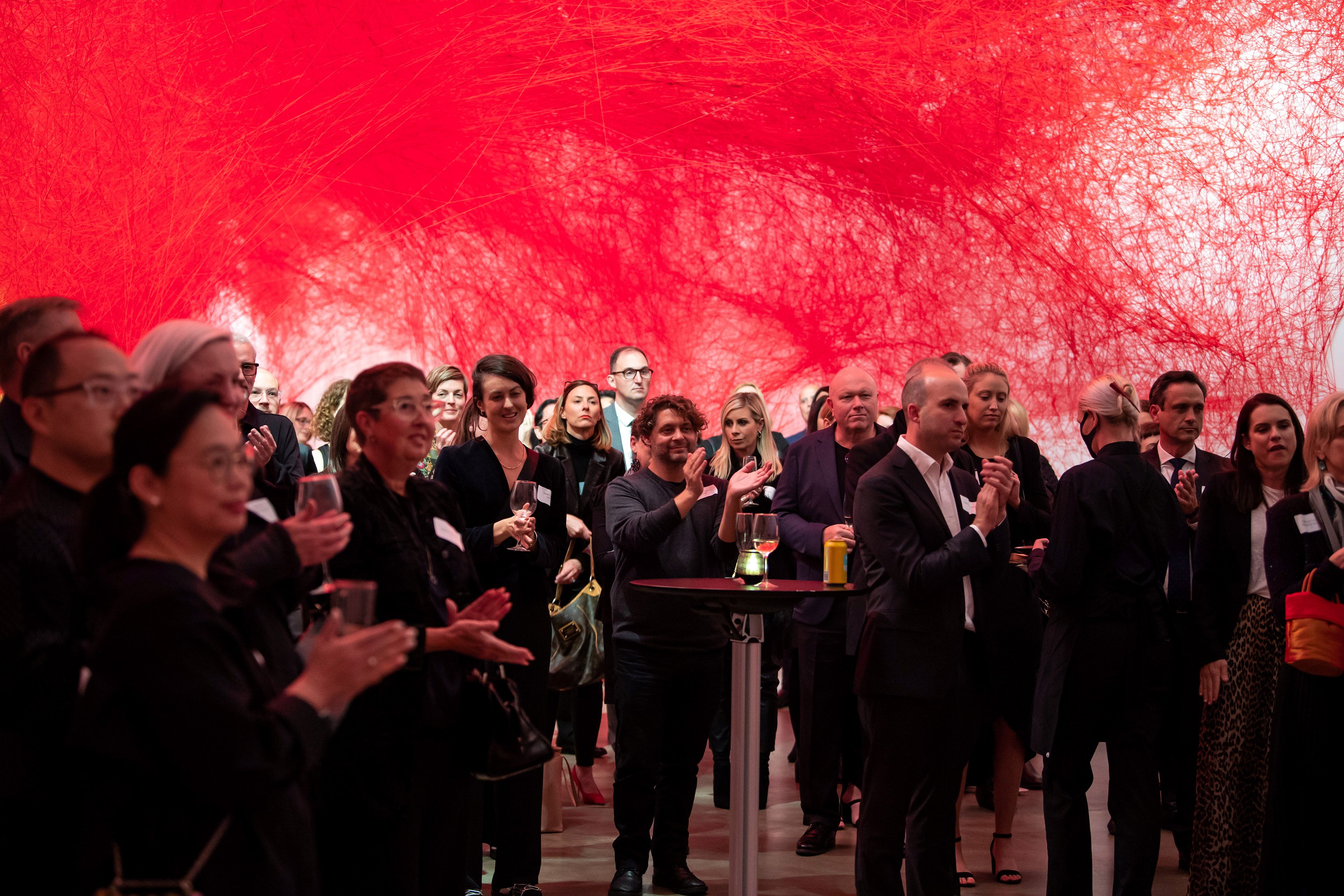 Members of the Gallery’s Asia Pacific Council and Chairman’s Circle enjoy the Business Leaders Network Signature Dinner, GOMA, July 2022, with Uncertain Journey 2016/2022 / Photograph: Lee Wilkes