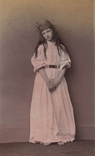 Lewis Carroll, England 1832–98 / Xie Kitchin, Captive Princess, 26 June 1875 1875 / Hand-tinted albumen photograph from wet plate negative
on paper / 15.1 x 9.3cm (comp.) / Purchased 2020 with funds from the Henry and Amanda Bartlett Trust through the Queensland Art Gallery | Gallery of Modern Art Foundation / Collection: Queensland Art Gallery | Gallery of Modern Art