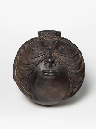 Mary Gole, Papua New Guinea b.1951 / Water storage pot - woman's face 2013 / Hand-thrown earthenware with incised decoration and beeswax / 36 x 34 x 34cm / Purchased 2015. Queensland Art Gallery | Gallery of Modern Art Foundation / Collection: Queensland Art Gallery |Gallery of Modern Art / © Mary Gole