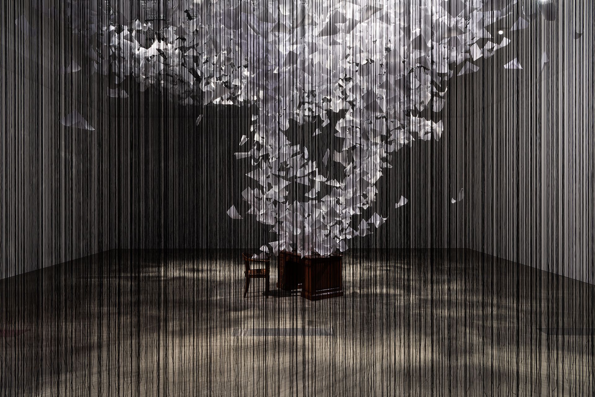 Chiharu Shiota / Japan/Germany b.1972 / Installation view of A question of perspective 2022 in ‘The Soul Trembles’, GOMA, June 2022 / Polypropylene ropes, 80gsmpaper, found furniture, cable ties, staples / Commissioned 2022 with funds from Tim Fairfax AC through the Queensland Art Gallery | Gallery of Modern Art Foundation / Collection: QAGOMA / © Chiharu Shiota / Photograph: Merinda Campbell, QAGOMA