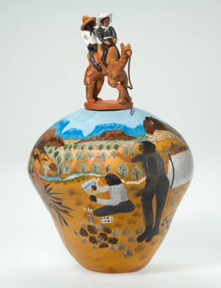 Hermannsburg Potters, Northern Territory, Australia est. 1990 / Irene Mbitjana Entata, Arrernte/Luritja people, Australia 1946–2014 / Rex and Albert painting in Palm Valley 2001 / Earthenware, hand-built terracotta clay with underglaze colours and applied decoration, leather / 50 x 29cm (diam.) (complete) / Purchased 2019. QAGOMA Foundation / Collection: Queensland Art Gallery | Gallery of Modern Art / © Irene Mbitjana Entata/Copyright Agency
