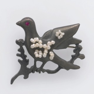 Barbara Heath, Australia b.1954 / Skylark 2005 / Oxidised sterling silver, white seed pearls, ruby / 3.2 x 4 x 0.5cm / Purchased 2006 with funds from the Estate of Jessica Ellis through the QAG Foundation / Collection: Queensland Art Gallery | Gallery of Modern Art / © Barbara Heath