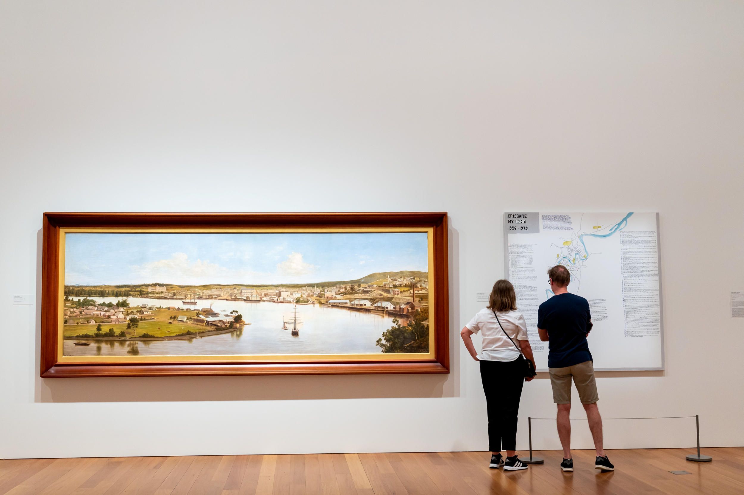 Left: J.A. Clarke / England/Australia 1840–90 / Panorama of Brisbane (installation view) 1880 / Oil on canvas / 137.1 x 365.7cm / Collection: Queensland Museum

Right: Noel Mckenna / Australia b.1956 / Brisbane: My Home (installation view) 1956-1979 2014 / Synthetic polymer paint on canvas / 160 x 160cm160 x 160 cm / Purchased 2014. Queensland Art Gallery | Gallery of Modern Art Foundation / Collection: Queensland Art Gallery | Gallery of Modern Art / © Noel McKenna/Copyright Agency 