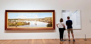 Left: J.A. Clarke / England/Australia 1840–90 / Panorama of Brisbane (installation view) 1880 / Oil on canvas / 137.1 x 365.7cm / Collection: Queensland Museum

Right: Noel Mckenna / Australia b.1956 / Brisbane: My Home (installation view) 1956-1979 2014 / Synthetic polymer paint on canvas / 160 x 160cm160 x 160 cm / Purchased 2014. Queensland Art Gallery | Gallery of Modern Art Foundation / Collection: Queensland Art Gallery | Gallery of Modern Art / © Noel McKenna/Copyright Agency 