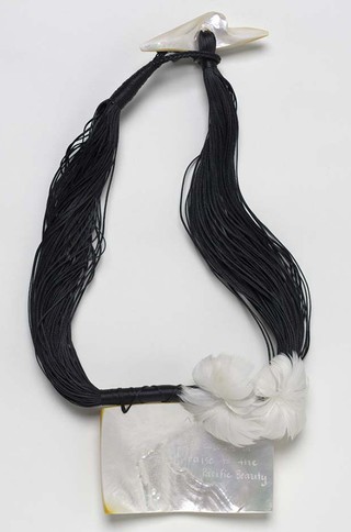 TEKELA-SMITH, Sofia New Zealand b.1970 Untitled (from ‘Lovely hula hands’ series) 2002 Mother of pearl with laser etched poetry by John Pule, feather flowers and waxed thread 39cm (long); breastplate: 12 x 17 x 5cm Acc. 2002.188 Purchased 2002