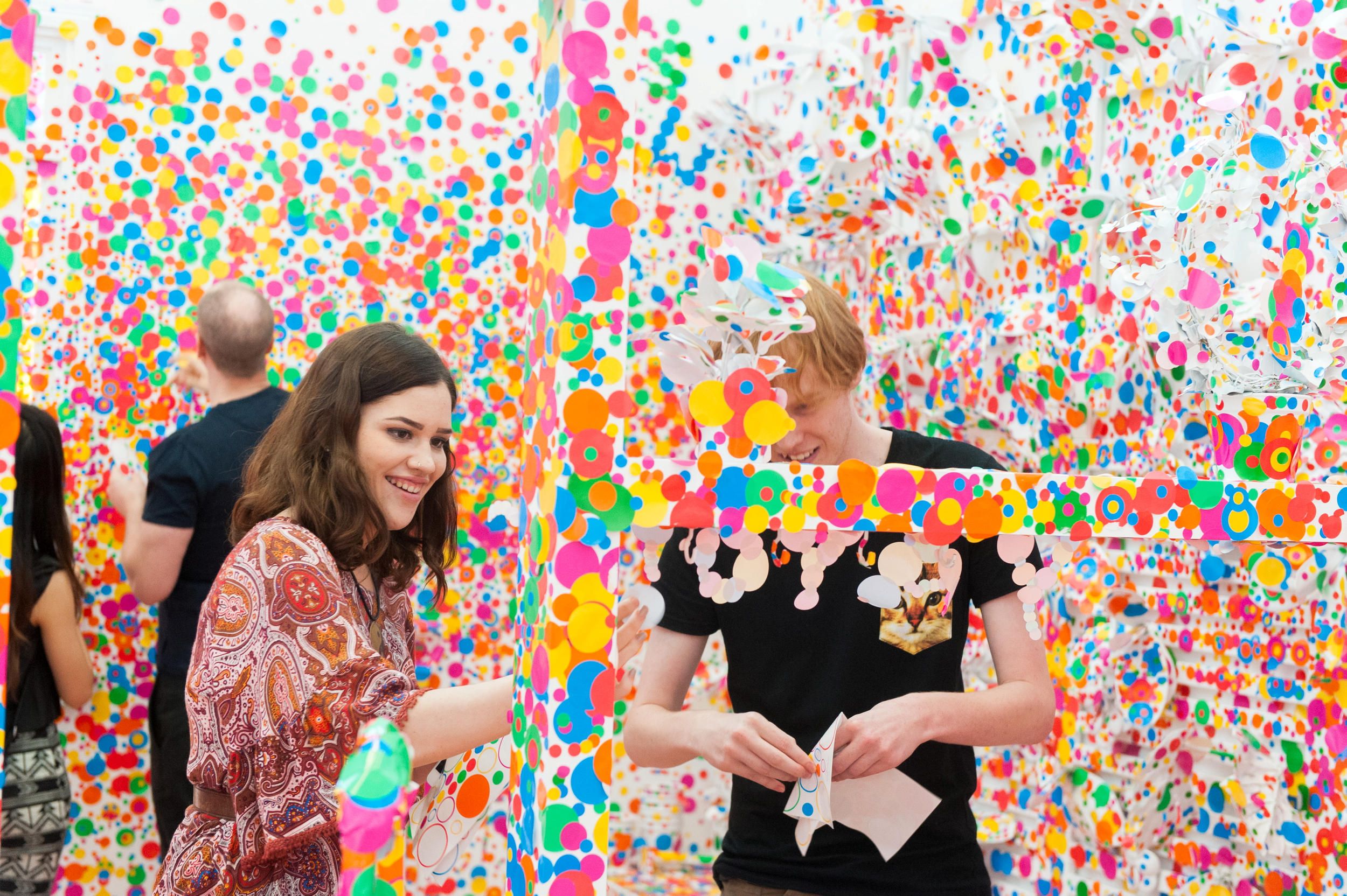 Yayoi Kusama, Japan b.1929 / The obliteration room (installation view) 2002-present / Furniture, white paint, dot stickers / Collaboration between Yayoi Kusama and Queensland Art Gallery. Commissioned Queensland Art Gallery. Gift of the artist through the QAGOMA Foundation 2012 / Collection: Queensland Art Gallery | Gallery of Modern Art / © Yayoi Kusama