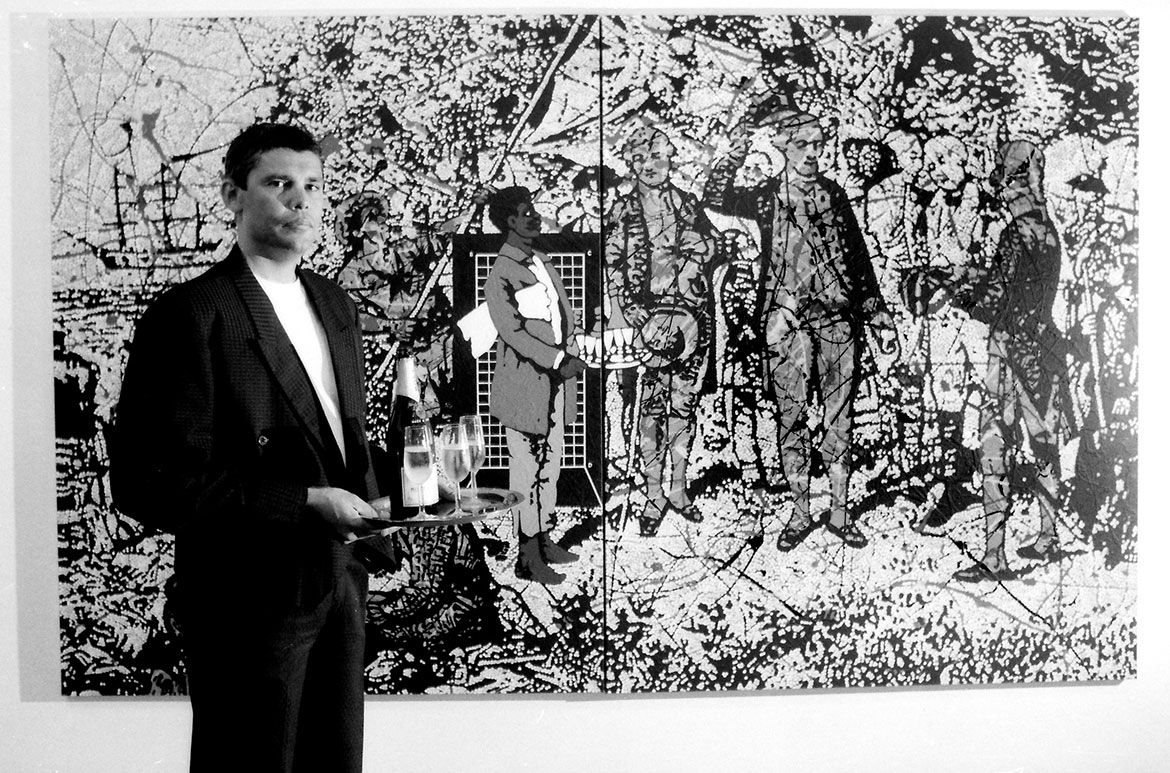 Gordon Bennett was awarded the Moët & Chandon Australian Art Fellowship in 1991, standing in front of Possession Island painted the same year in France during hi travel scholarship / Image courtesy: Gordon Bennett Estate