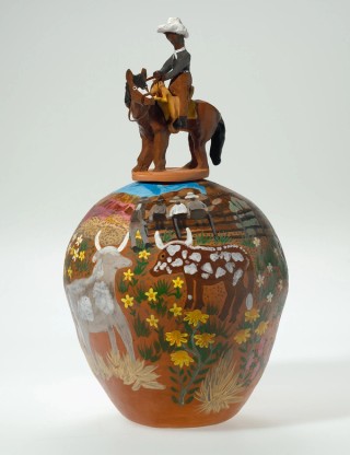 Hermannsburg Potters, Northern Territory, Australia est. 1990 / Irene Mbitjana Entata, Arrernte/Luritja people, Australia 1946-2014 / Albert Namatjira droving 2001 / Earthenware, hand-built terracotta clay with underglaze colours and applied decoration, leather / 53 x 36cm (diam.) (complete) / Purchased 2019. QAGOMA Foundation / Collection: Queensland Art Gallery | Gallery of Modern Art / © Irene Mbitjana Entata/Copyright Agency