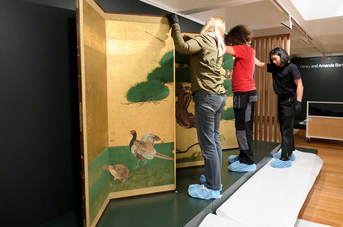 Installing A pair of six-fold screens with pine trees c.1650 / Photograph: C Callistemon © QAGOMA