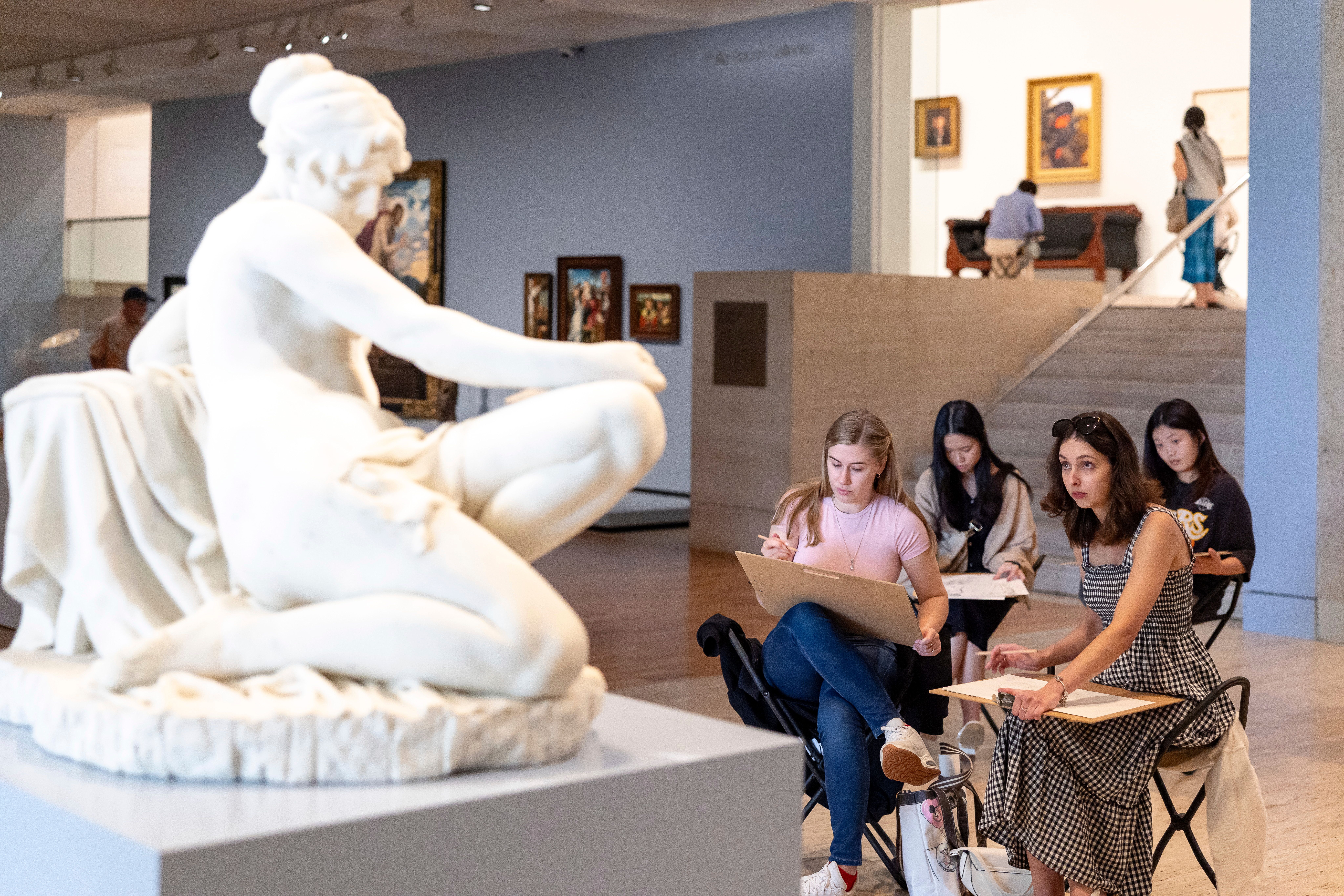 Visitors sketch Giacomo Ginotti's 19th century sculpture Lucretia at the Drawing Festival, QAG, May 2025 / Photograph: Katie Bennett, courtesy QAGOMA
