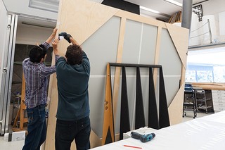 Collection Relocation and Mezzanine project 2016-17 Collection preparation in Conservation Mandy Smith and Andrew Moynihan putting Kemp painting into handling frame (also, Anne Carter, Phil Lawless, Matt Dabrowski, Mel Smith assisting with movements) KEMP, Roger Tapestry – Tableau (Vertical and horizontal concept) 1972 Acc. 1994.206