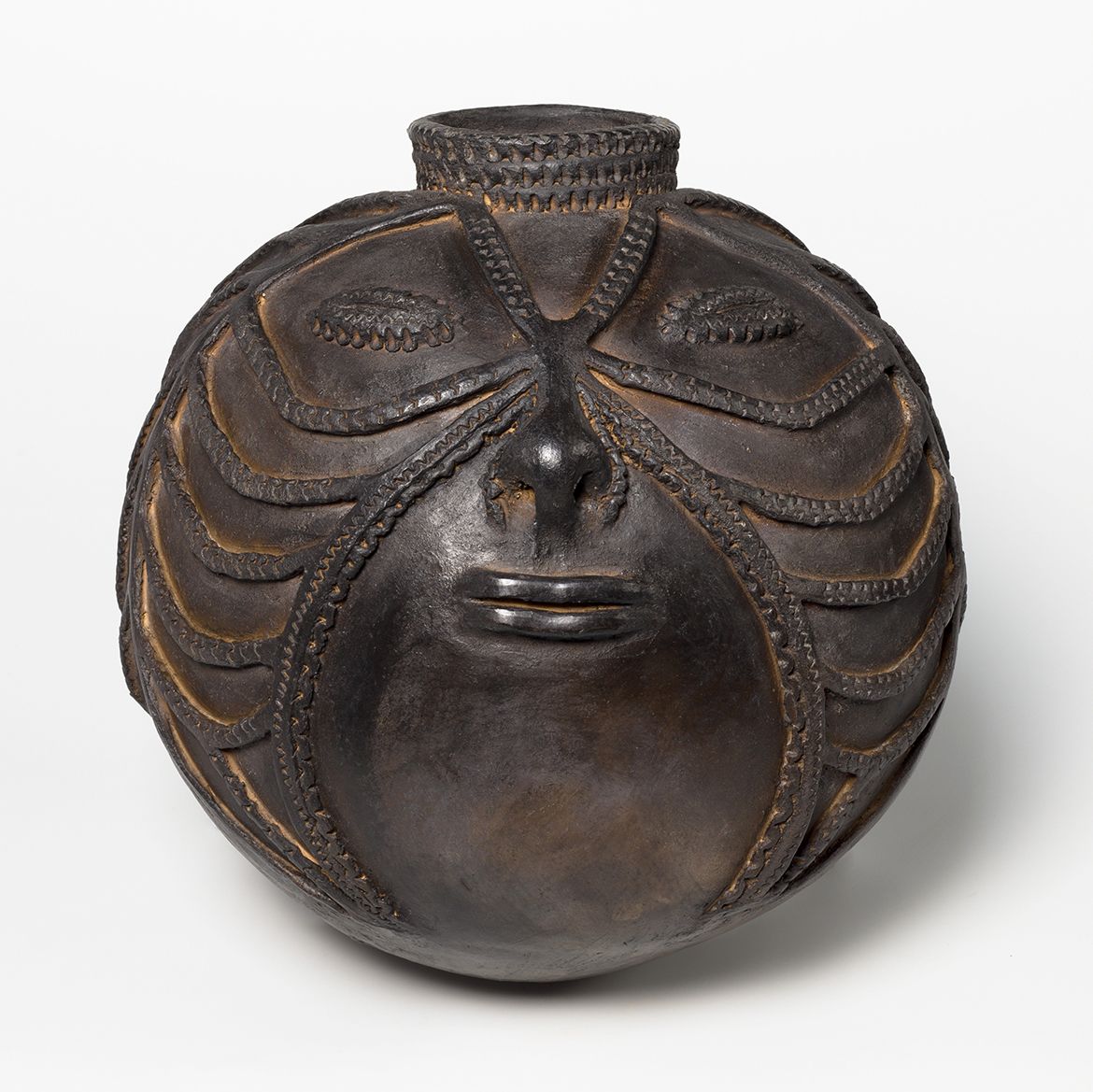 Joyce Mary Arasepa Gole, OL, Papua New Guinea b.1941 / Water storage pot – woman’s face 2013 / Hand-thrown earthenware with incised decoration and beeswax / 33.5 x 33.4 x 33.2cm / Purchased 2015. Queensland Art Gallery | Gallery of Modern Art Foundation / Collection: Queensland Art Gallery | Gallery of Modern Art / © Joyce Mary Aresepa Gole, OL Estate