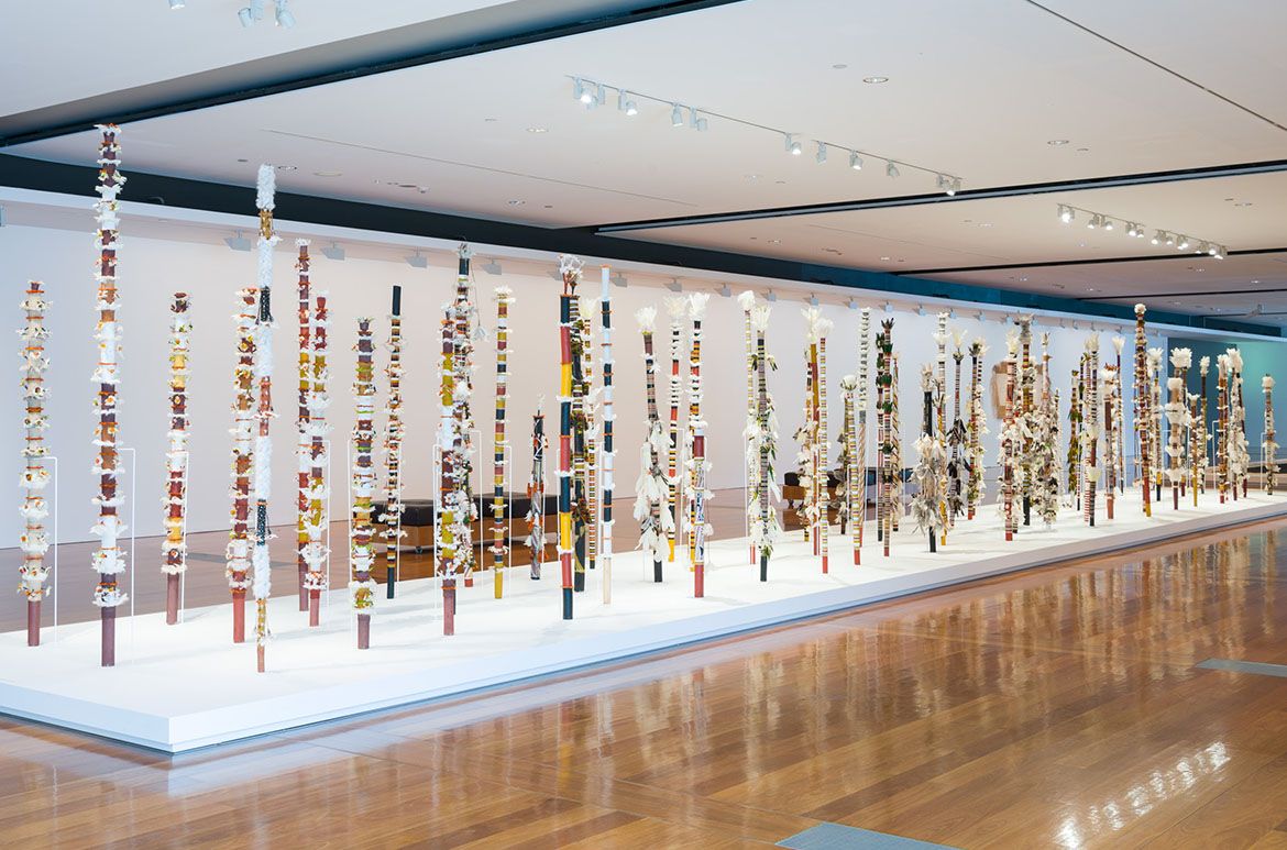 Henry Gambika Nupurra Dhamarandji; Trevor Gurruwiwi; Richard Galnardiwuy; Gali Yalkarriwuy Gurruwiwi; David Lakarriny Gurruwiwi Paul Gurruwiwi / Banumbirr (Morning Star poles)1995-2013 / Wood, bark fibre string, cotton thread, cotton thread with natural pigments, feathers, native beeswax, beeswax with synthetic polymer paint, natural pigments / Collection: Queensland Art Gallery / © The artists/Licensed by Viscopy, 2017