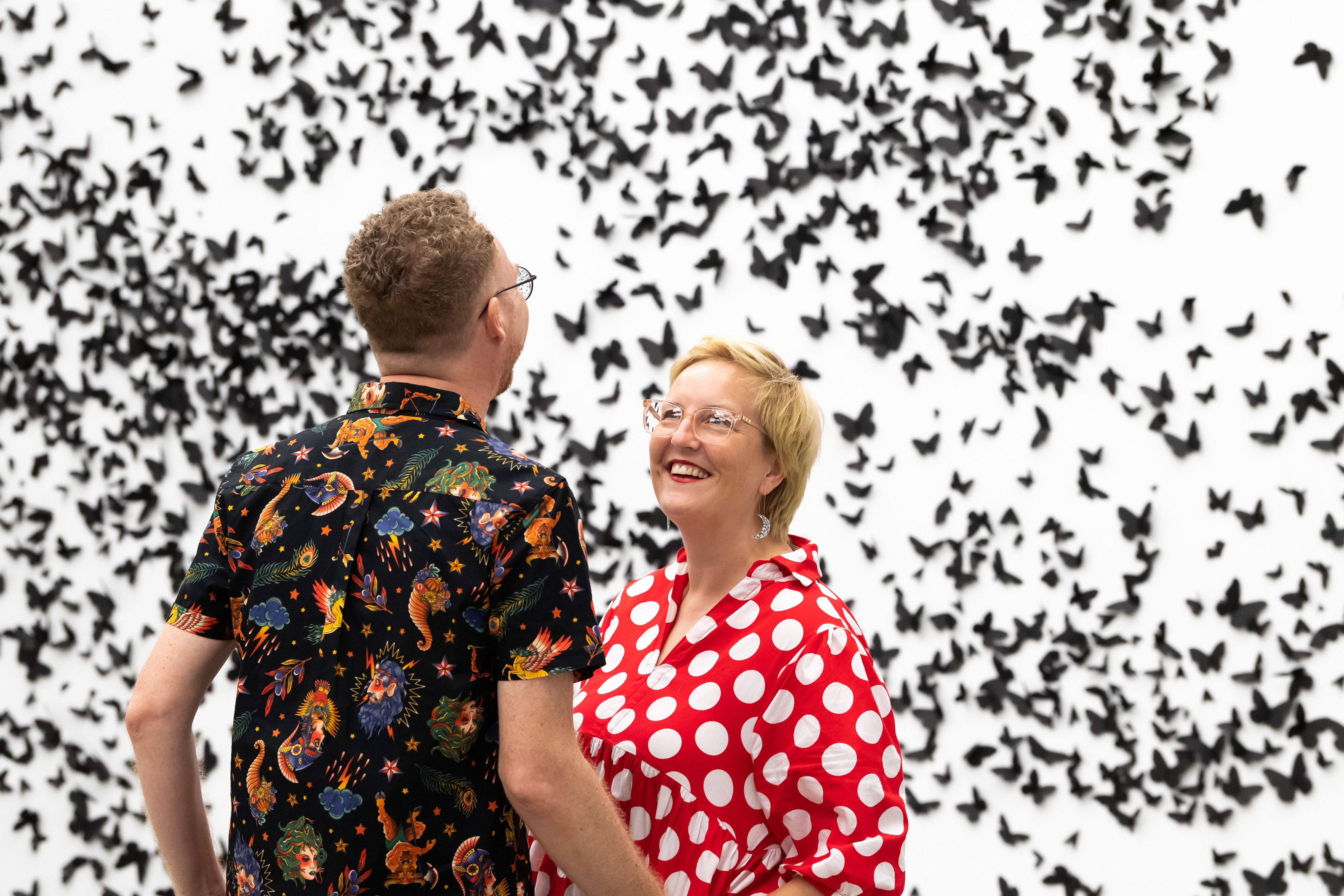 Members enjoying a private viewing of 30 000 black laser-cut and handfolded paper butterflies and moths in Carlos Amorales’ Black Cloud 2007/2018 during ‘Air’ at the Gallery of Modern Art / © Carlos Amorales / Photograph: M Campbell © QAGOMA
