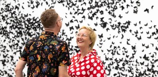 Members enjoying a private viewing of 30 000 black laser-cut and handfolded paper butterflies and moths in Carlos Amorales’ Black Cloud 2007/2018 during ‘Air’ at the Gallery of Modern Art / © Carlos Amorales / Photograph: M Campbell © QAGOMA