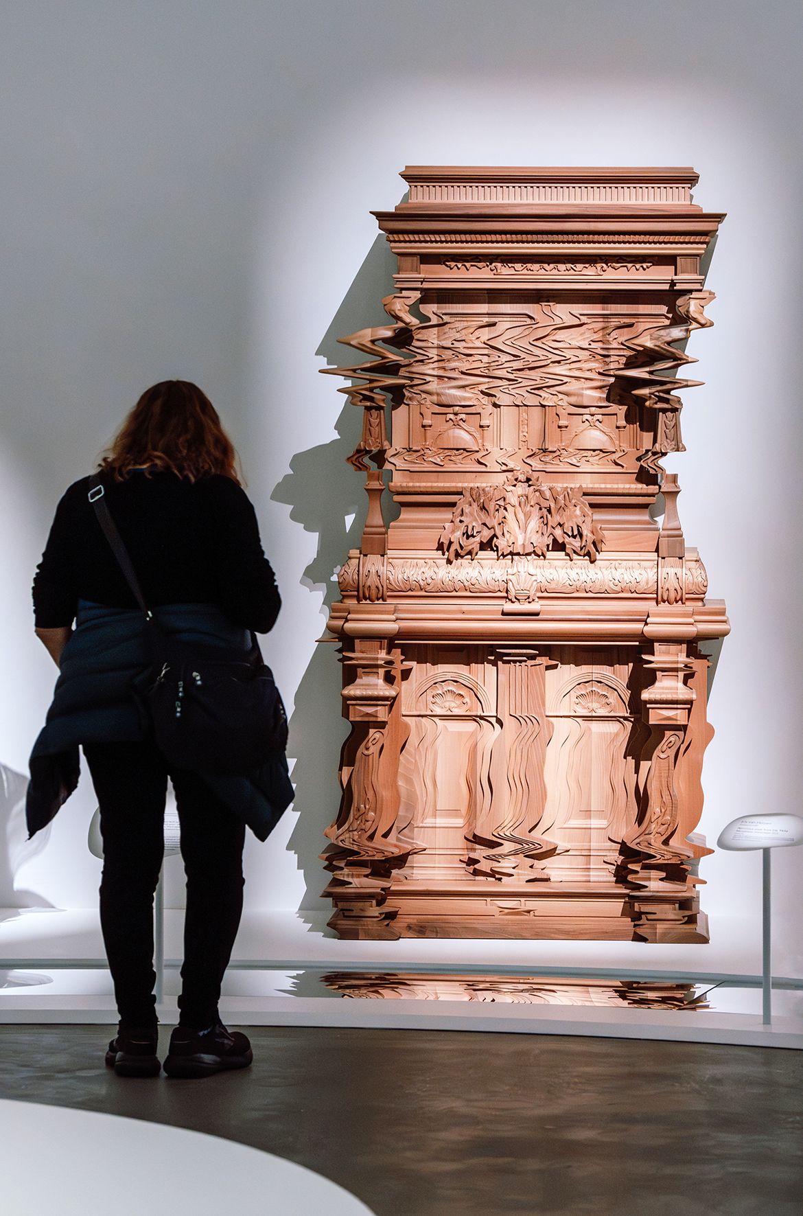 Ferruccio Laviani, Italy b.1960 / Good Vibrations Cabinet 2013 installed in ‘Iris van Herpen: Sculpting the Senses’, GOMA 2024 / Conceived for Italian furnishing company Fratelli Boffi / Oak and walnut, sculpted, chiselled and engraved using digital processes / Purchased from Fratelli Boffi thanks to the patronage of Cercle Design 20/21/2020 / Collection: Musée des Arts Décoratifs, Paris / © Ferruccio Laviani / Photograph: J Ruckli © QAGOMA